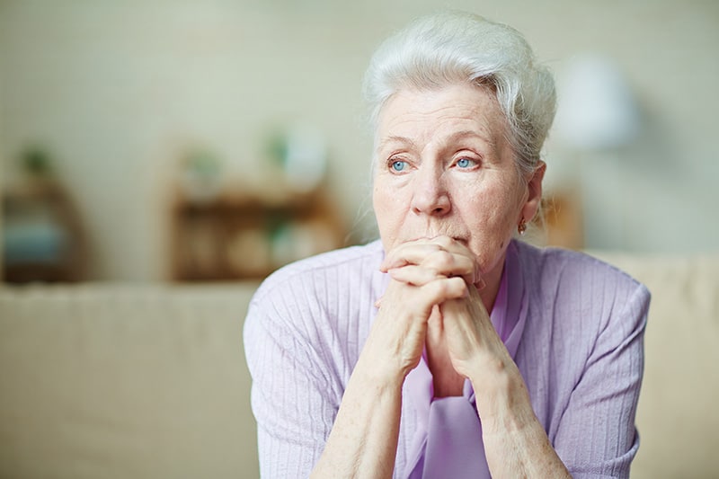 Elderly Woman Looking Pensive